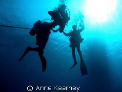 5 meters stop, holding on a rope because of the current t... by Anne Kearney 